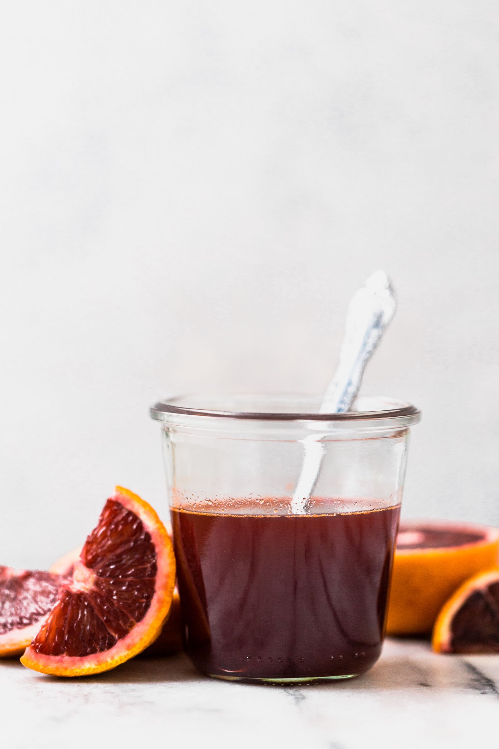 also known as what happens when you spike cold brew coffee with the perfectly not-too-sweet blood orange syrup, blood orange cold brew iced coffee will be your newest winter citrus obsession! #bloodorange #coldbrew #coldbrewcoffee #coldbrewcoffeerecipe #icedcoffee #wintercitrus #playswellwithbutter