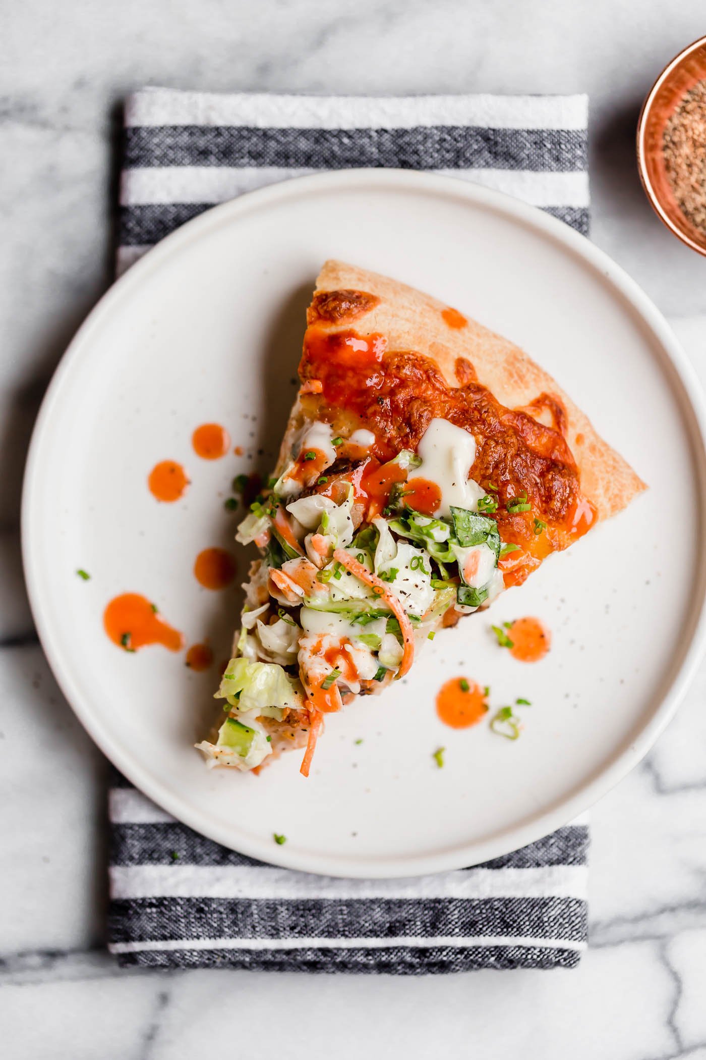 easy buffalo chicken bacon ranch pizza. the easiest buffalo chicken bacon ranch pizza, topped with a fresh & crunchy salad for a fun twist on pizza night! with only 5 ingredients, this buffalo chicken bacon ranch pizza is perfect for an easy weeknight pizza dinner & great for game day parties this fall! #playswellwithbutter #homemadepizza #buffalochickenpizza #chickenbaconranchpizza #pizzanight #easypizzarecipe #easydinnerrecipe #gamedayfood #partyfood