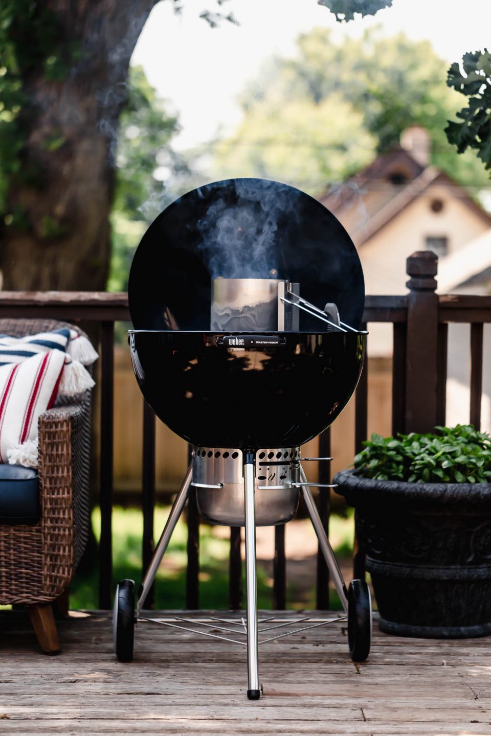 A 22-inch original weber grill lit using a charcoal chimney and preheating.