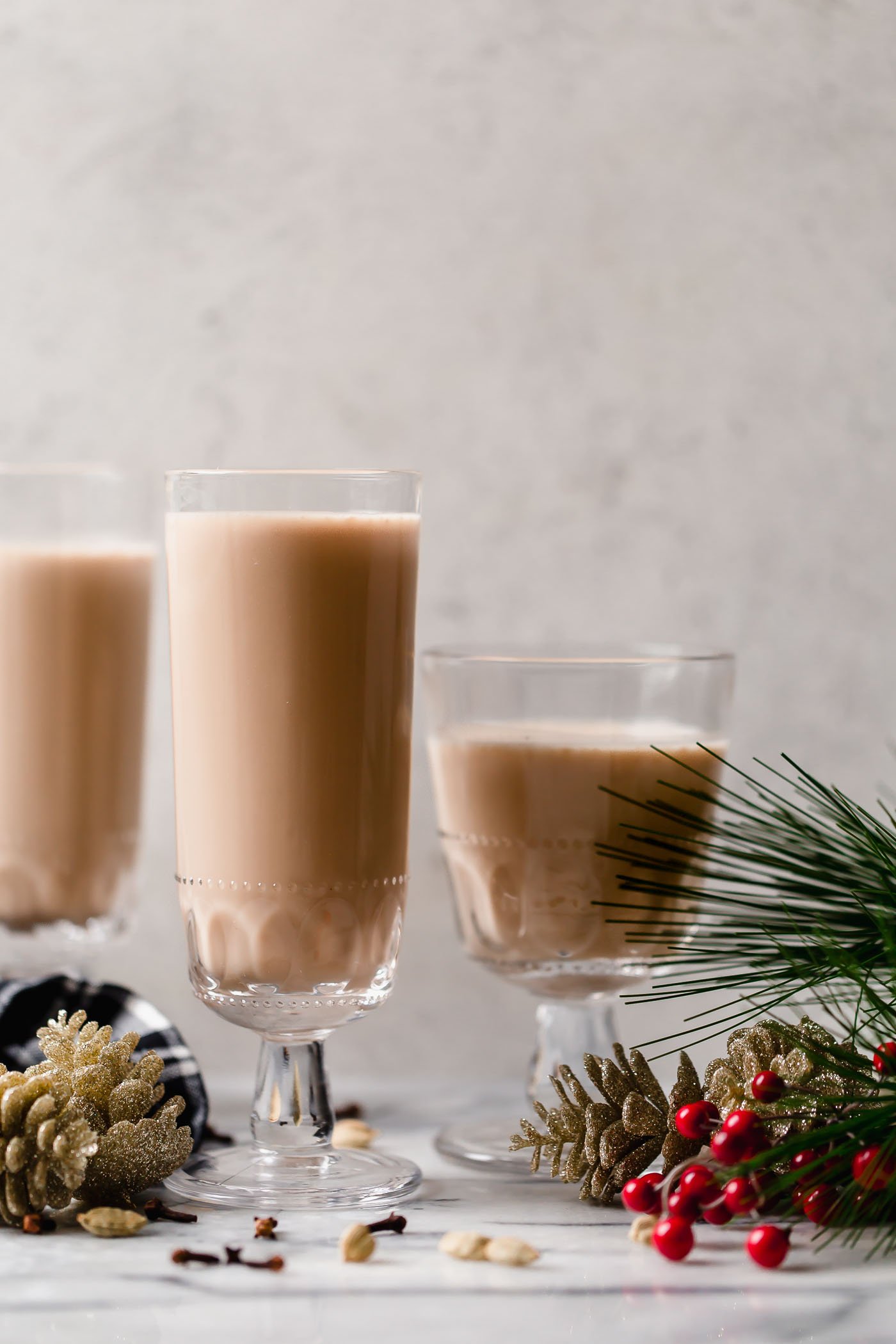 smoky spiked coconut chai tea latte. an easy spiked chai tea recipe! a coconut chai tea latte, lightly sweetened with maple syrup & spiked with mezcal & tequila. an easy & cozy boozy chai tea that’s perfect to warm up on a cold winter night during the holiday season. #playswellwithbutter #spikedchaitea #spikedchailatte #spikedchai #chaicocktail #coconutchai #easycocktailrecipes #fallcocktailrecipes #wintercocktailrecipes #holidaycocktailrecipes #christmascocktailrecipes #mezcalcocktails