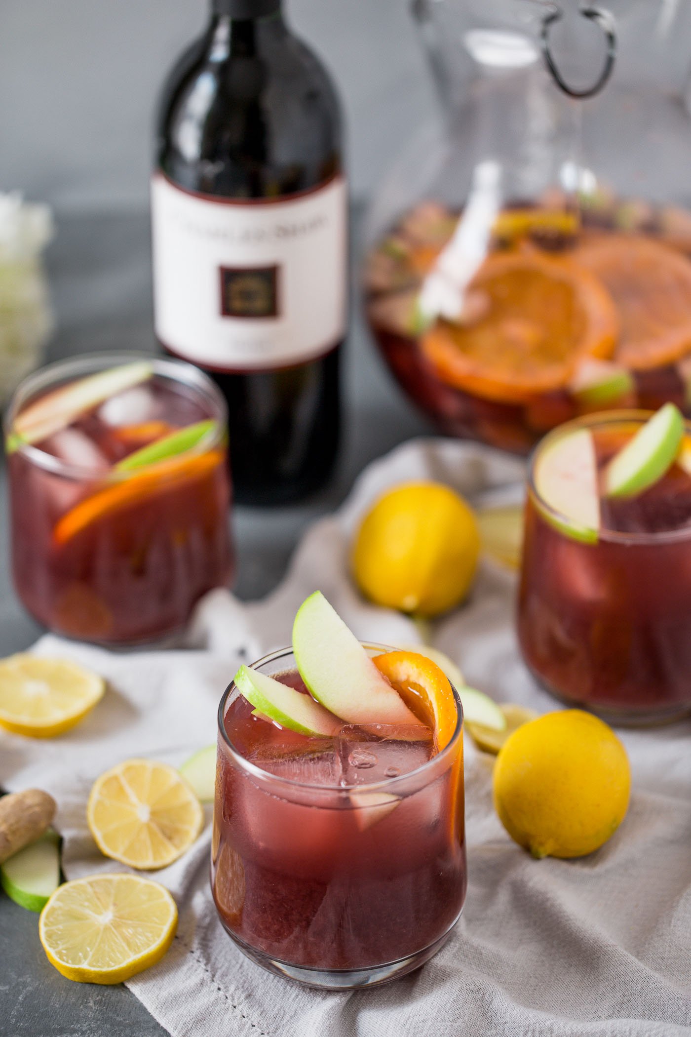 this two buck chuck sangria is an easy & inexpensive red wine sangria recipe featuring trader joe’s famous charles shaw wine. make two buck chuck sangria one pitcher at a time - the perfect drink to serve at girls night, holiday parties, dinner parties, & more! #playswellwithbutter #sangria #drinkrecipe #twobuckchuck #traderjoes #traderjoesrecipe