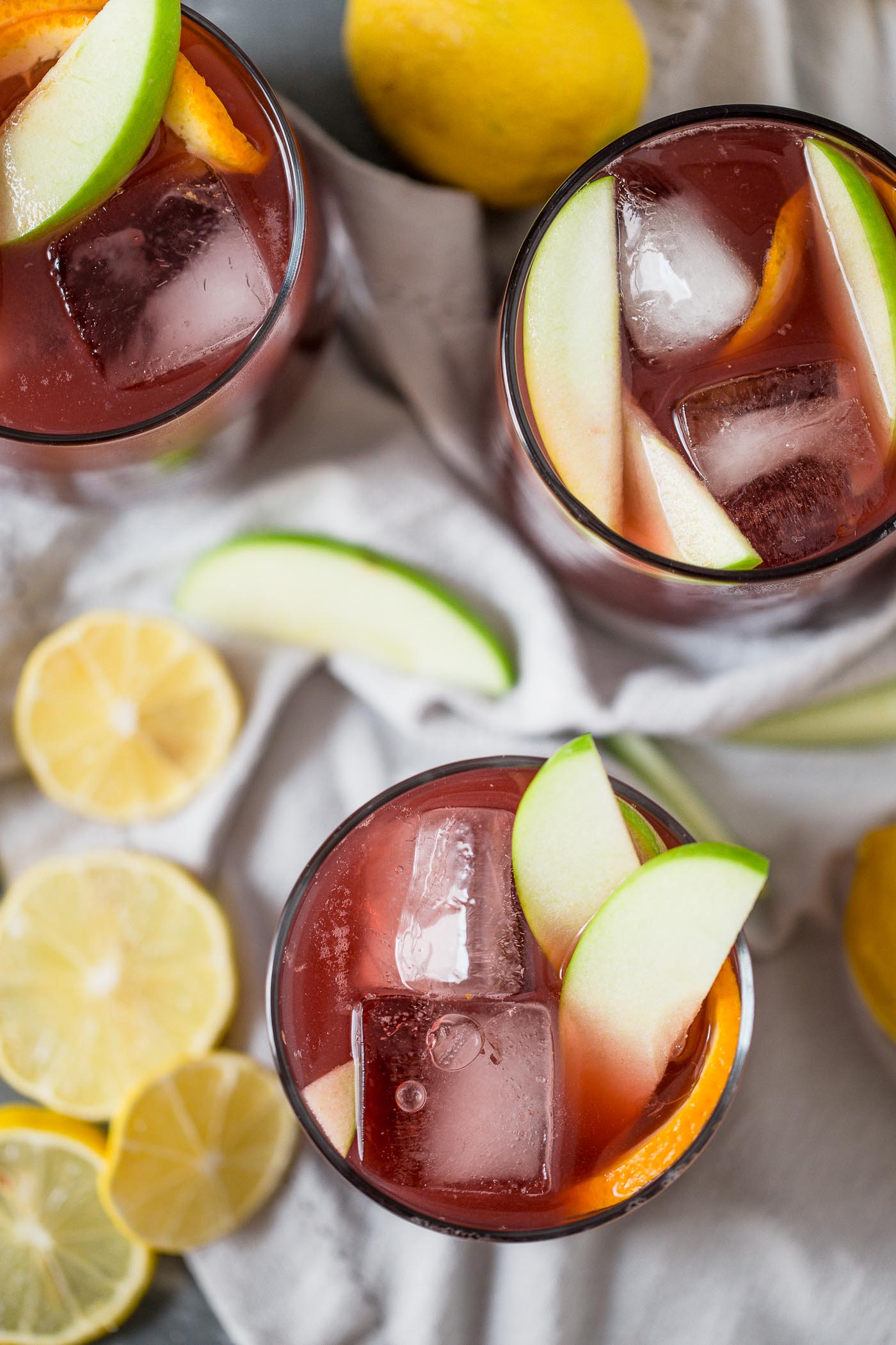 this two buck chuck sangria is an easy & inexpensive red wine sangria recipe featuring trader joe’s famous charles shaw wine. make two buck chuck sangria one pitcher at a time - the perfect drink to serve at girls night, holiday parties, dinner parties, & more! #playswellwithbutter #sangria #drinkrecipe #twobuckchuck #traderjoes #traderjoesrecipe