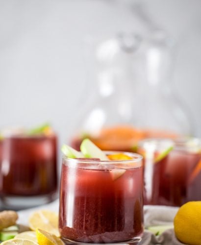this two buck chuck sangria is an easy & inexpensive red wine sangria recipe featuring trader joe’s famous charles shaw wine. make two buck chuck sangria one pitcher at a time - the perfect drink to serve at girls night, holiday parties, dinner parties, & more! #playswellwithbutter #sangria #drinkrecipe #twobuckchuck #traderjoes #traderjoesrecipe